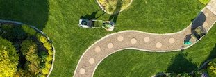 Bird's eye view of a lawn being mowed